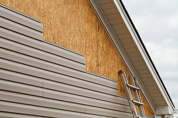 Professional Emergency Siding Repair technician working in Tobaccoville, NC